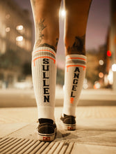 Load image into Gallery viewer, sullen angel high socks worn by tattooed model